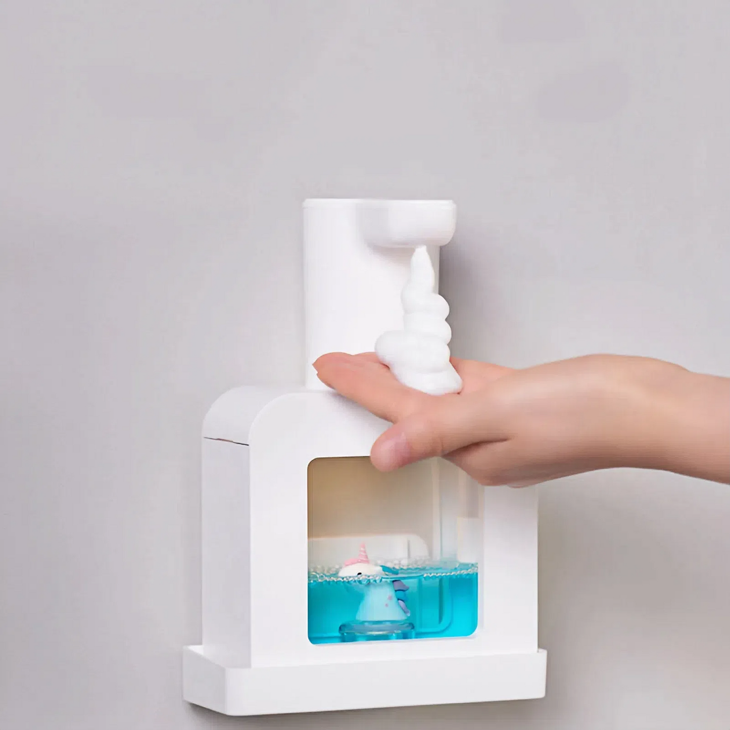White Unicorn Sudsie Automatic Foam Soap Dispenser dispensing