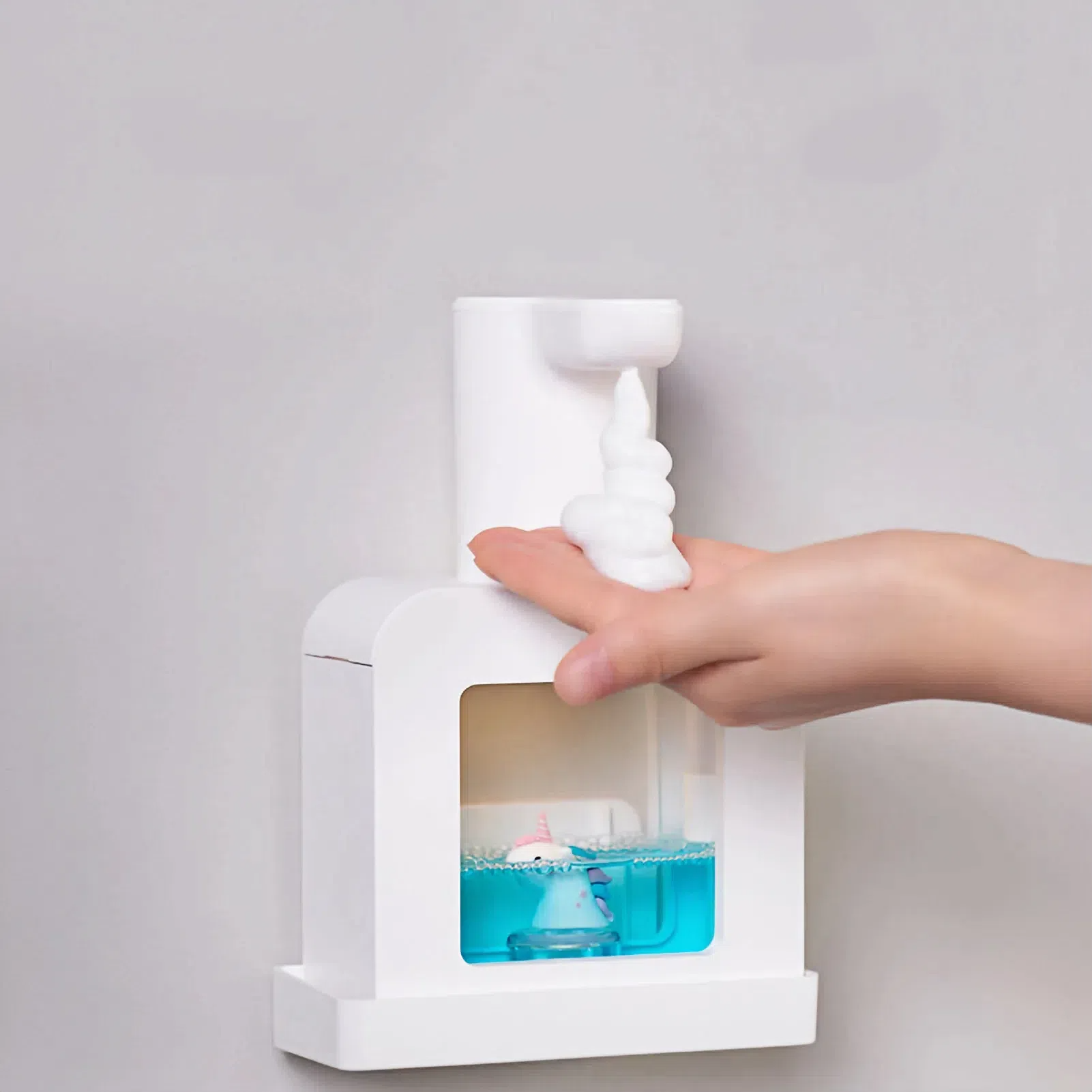 White Unicorn Sudsie Automatic Foam Soap Dispenser dispensing